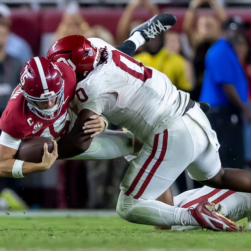 Alabama quarterback Ty Simpson (left) is tackled by Oklahoma defensive tackle David Stone during their game on Saturday, Nov. 15, 2025, in Tuscaloosa, Ala. Oklahoma plays No. 2-ranked Georgia at 3:30 p.m. Saturday. (Vasha Hunt/AP)