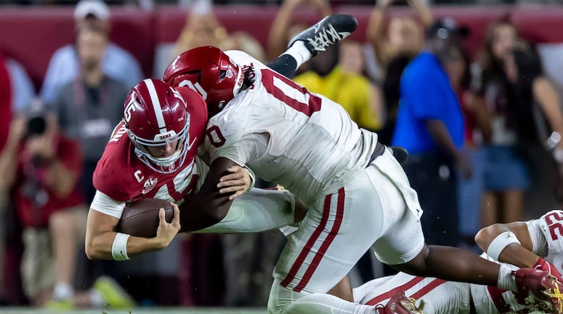 Alabama quarterback Ty Simpson (left) is tackled by Oklahoma defensive tackle David Stone during their game on Saturday, Nov. 15, 2025, in Tuscaloosa, Ala. Oklahoma plays No. 2-ranked Georgia at 3:30 p.m. Saturday. (Vasha Hunt/AP)