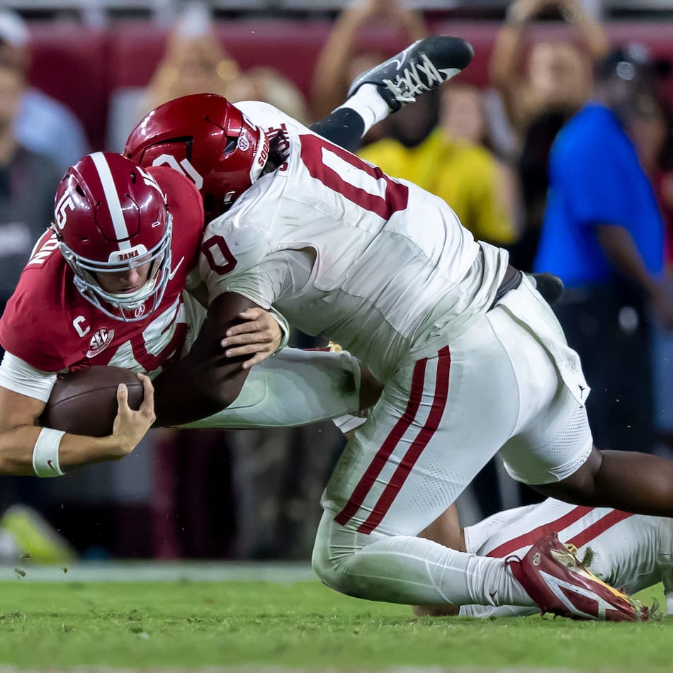 Alabama quarterback Ty Simpson (left) is tackled by Oklahoma defensive tackle David Stone during their game on Saturday, Nov. 15, 2025, in Tuscaloosa, Ala. Oklahoma plays No. 2-ranked Georgia at 3:30 p.m. Saturday. (Vasha Hunt/AP)