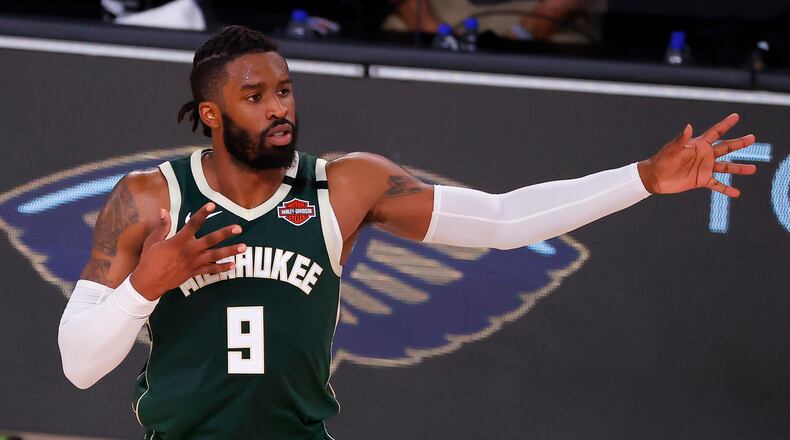 Wesley Matthews of the Milwaukee Bucks reacts after hitting a 3-point basket against the Dallas Mavericks at The Arena at ESPN Wide World Of Sports Complex on August 8, 2020, in Lake Buena Vista, Florida. (Kevin C. Cox/Getty Images/TNS)