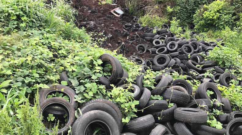 Tires litter the Old Atlanta Prison Farm in May.