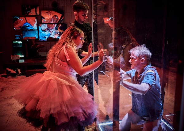 This image released by Heartbeat Opera shows soprano Summer Hassan as Salome, left, and baritone Nathaniel Sullivan as John the Baptist, in a scene from Heartbeat Opera's production of Richard Strauss' "Salome" in The Space at Irondale in New York on Feb. 1, 2025. (Andrew Boyle/Heartbeat Opera via AP)