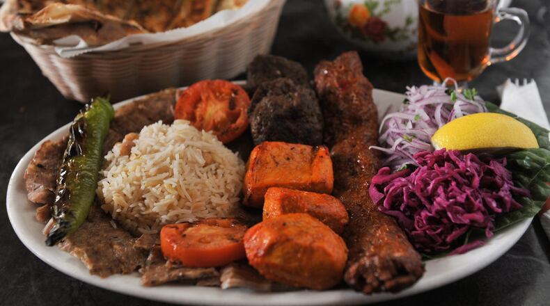 A photo from Cafe Istanbul in Decatur of a mixed grill platter of gyro, adana kabob, chicken kabob and kofte.