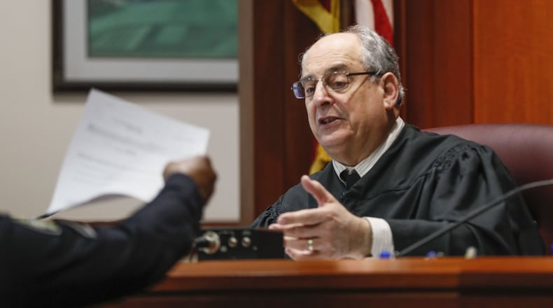 Nearly 7,500 distracted driving citations were dismissed last year in Atlanta Municipal Court. Judge Gary Jackson said nearly all of those cases were dropped under a provision that allows first offenders to bring a receipt for a hands-free device to court to have their citation dismissed. Bob Andres / robert.andres@ajc.com