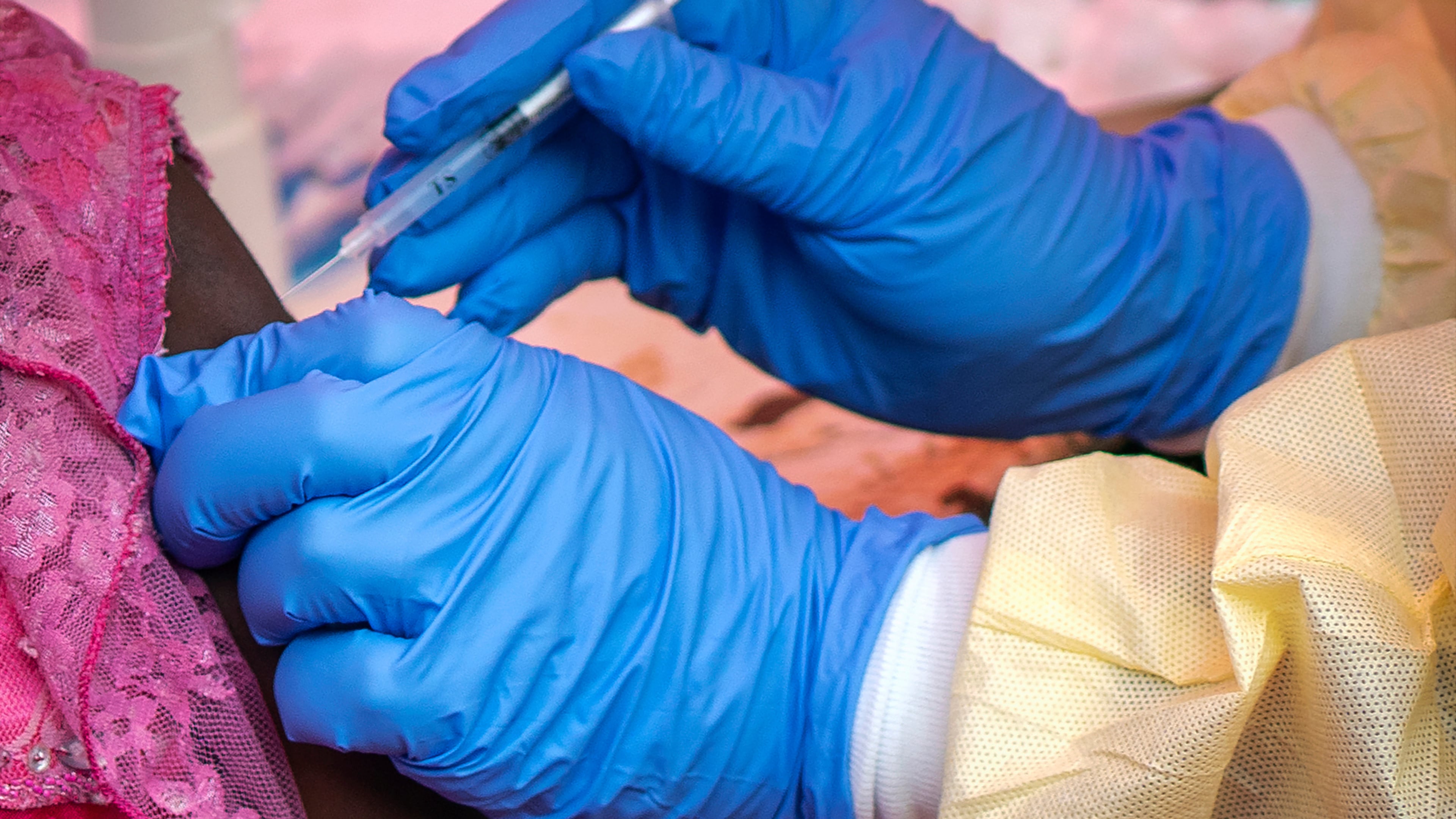 FILE - In this Saturday, July 13, 2019 file photo, a person is vaccinated against Ebola in Beni, Congo. (AP Photo/Jerome Delay, File)