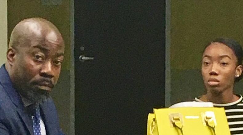 Okeeba Jubalo with his daughter Sol Brown, who he said was attacked by five other Decatur High girls on Nov. 10. Bill Banks for the AJC