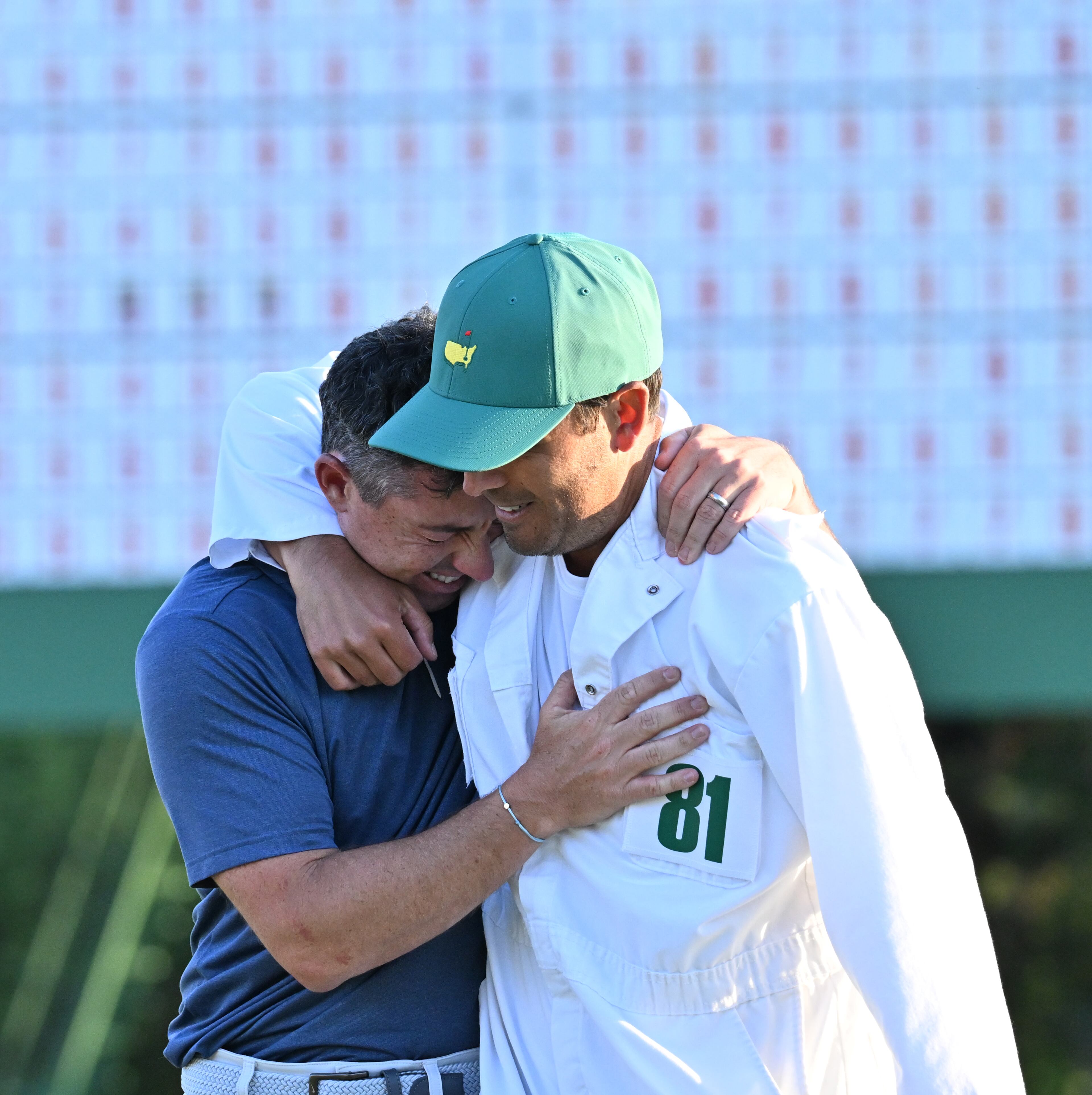 Rory McIlroy celebrates with caddie Harry Diamond, winning the Masters golf tournament with a birdie in the first playoff hole during final round of the Masters golf tournament, at Augusta National Golf Club, Sunday, April 13, 2025, in Augusta, Ga. (Hyosub Shin / AJC)
