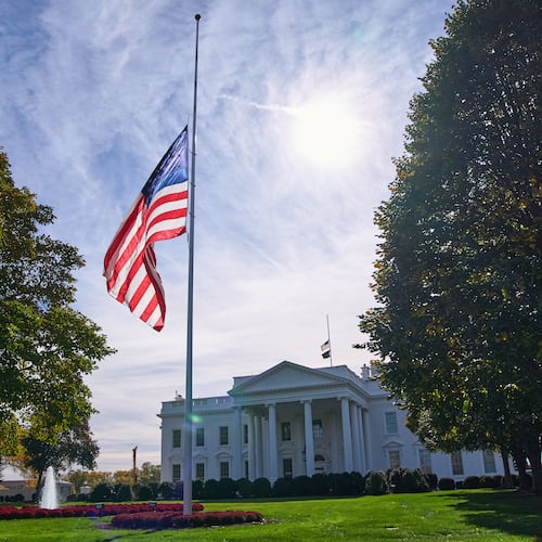 The American flag is seen at half-staff, Tuesday, Nov. 4, 2025, at the White House in Washington. (AP Photo/Jacquelyn Martin)