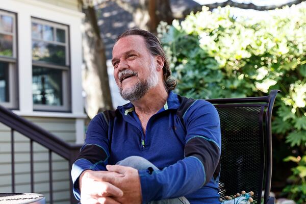 Rick Schroeder sits in his backyard where he creates various wood projects on Thursday, November 3, 2022. (Natrice Miller/natrice.miller@ajc.com)  