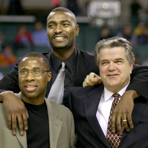 FILE - Members of the 1986 Cleveland State University men's basketball team, from left, Shawn Hood, Eric Mudd, coach Kevin Mackey, and Pat Vuyanich are honored during halftime of an NCAA college basketball game, Jan. 20, 2001, in Cleveland. (Larry Hamel-Lambert/The Plain Dealer via AP, File)