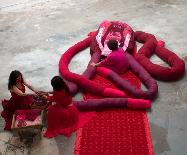 From left, Shoshana Caldas, artist Jessica Caldas and Marco Caldas created a performance based on the artwork in the MOCA GA exhibition. Photo: Courtesy of DeDe Ajavon