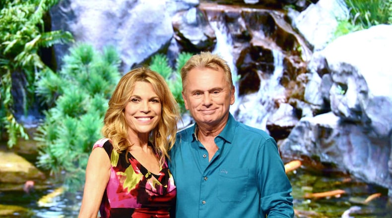 'Wheel of Fortune' hosts Vanna White, left, and Pat Sajak attend a taping of the show's 35th Anniversary Season at Epcot Center at Walt Disney World in Orlando, Florida.