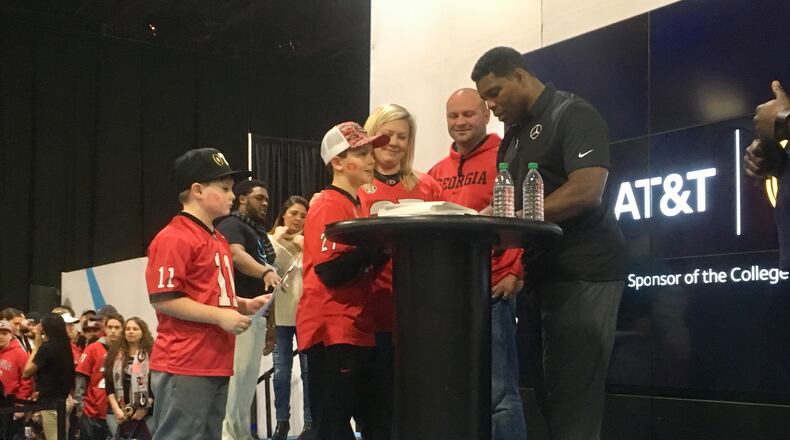 After three hours, the Wright family got to meet UGA legend Herschel Walker. Photo: Jennifer Brett