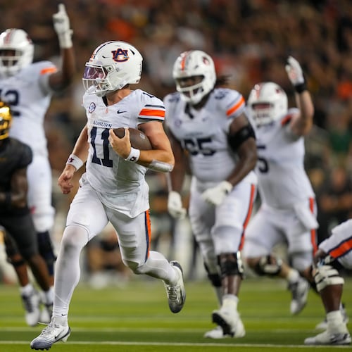 FILE - Auburn quarterback Jackson Arnold (11) runs for a touchdown against Baylor during the second half of an NCAA college football game, Aug. 29, 2025, in Waco, Texas. (AP Photo/Julio Cortez, File)