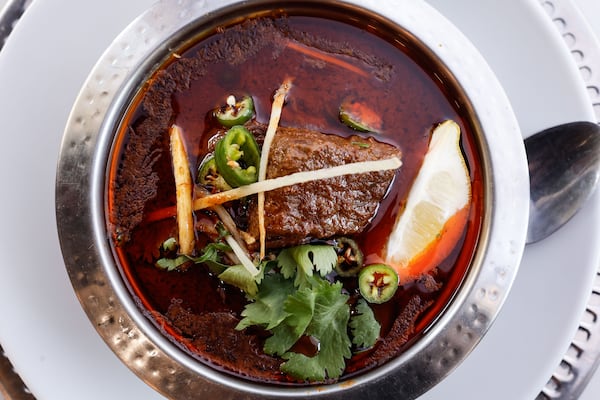 Tear off strips of warm tandoori or butter naan and soak up every last bit of Namak's halal beef nihari. (Natrice Miller/AJC)