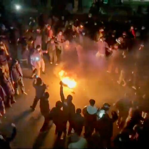 In this frame grab from footage circulating on social media shows protesters dancing and cheering around a bonfire as they take to the streets despite an intensifying crackdown as the Islamic Republic remains cut off from the rest of the world, in Tehran, Iran, Friday, Jan. 9, 2026.(UGC via AP)