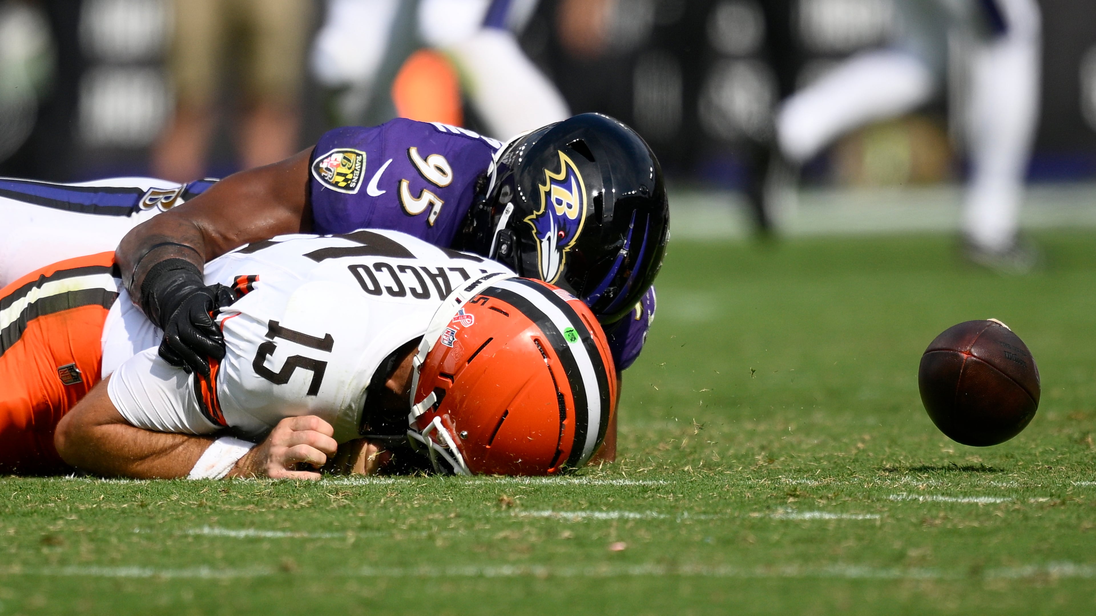 Baltimore Ravens linebacker Tavius Robinson sacks Cleveland Browns quarterback Joe Flacco forcing a fumble during the second half of an NFL football game, Sunday, Sept. 14, 2025, in Baltimore. (AP Photo/Nick Wass)