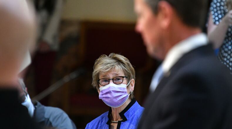 Governor Brian Kemp speaks as Dr. Kathleen Toomey, Commissioner of Georgia Department of Public Health, looks on during a press conference to give an update on COVID-19 vaccine at the Georgia State Capitol in Atlanta, on Tuesday, January 26, 2021. (Hyosub Shin / Hyosub.Shin@ajc.com)