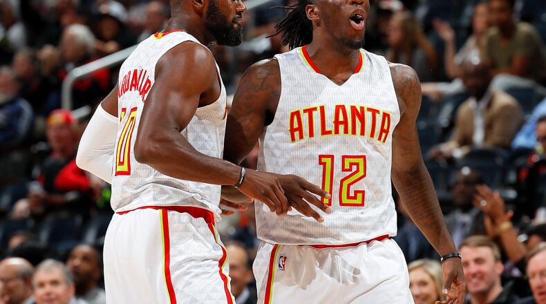 Taurean Prince (12) of the Atlanta Hawks reacts after assisting on a 3-point basket by Tim Hardaway Jr. (10) against the Milwaukee Bucks at Philips Arena on November 16, 2016 in Atlanta, Georgia. (Photo by Kevin C. Cox/Getty Images)