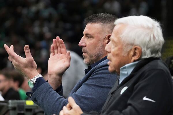 New England Patriots head coach Mike Vrabel, left, applauds while seated with team owner Robert Kraft during the first half in game 2 of a first-round NBA playoff basketball series between the Boston Celtics and Orlando Magic, Wednesday, April 23, 2025, in Boston. (AP Photo/Charles Krupa)