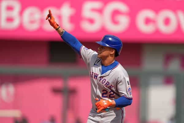 New York Mets' Juan Soto celebrates after hitting a two-run home run during the fourth inning of a baseball game against the Kansas City Royals, Saturday, July 12, 2025, in Kansas City, Mo. (AP Photo/Charlie Riedel)
