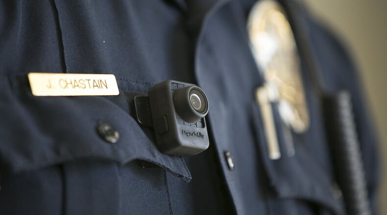 Many view police body cameras as the answer to concerns about accountability. (AJC photo)