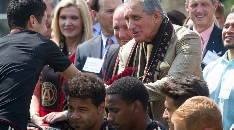 Atlanta United Owner and Chairman Arthur Blank shakes hands with one of the Atlanta United soccer players after the ground breaking ceremony of the Children’s Healthcare of Atlanta Training Ground in Marietta GA Tuesday 11, 2017. STEVE SCHAEFER / SPECIAL TO THE AJC