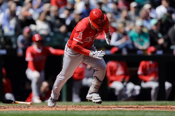 Los Angeles Angels' Mike Trout runs to first on a ground out against the Seattle Mariners during the third inning of a baseball game, Wednesday, April 30, 2025, in Seattle. (AP Photo/John Froschauer)