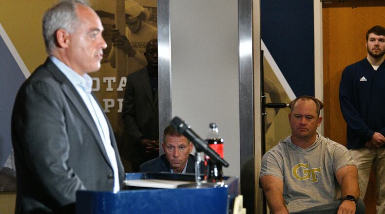 Georgia Tech President Ángel Cabrera speaks during a press conference to introduce Interim A.D. Frank Neville (background left) and Interim head coach Brent Key at Georgia Tech's athletics center in Atlanta on Tuesday, September 27, 2022. (Hyosub Shin / Hyosub.Shin@ajc.com)