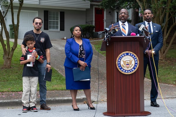 U.S. Sen. Raphael Warnock talks about the 21st Century ROAD to Housing Act during a press conference in Atlanta's Adamsville neighborhood. (Ben Gray for the AJC)