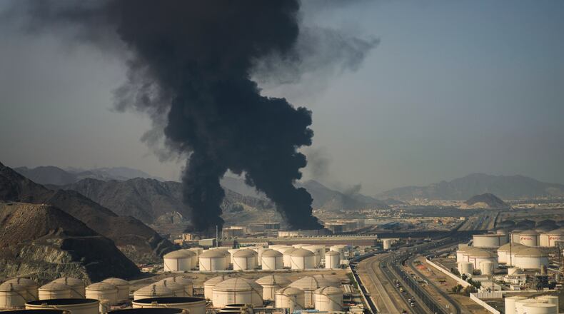 Plumes of smoke rise from an oil facility in Fujairah, United Arab Emirates, Saturday, March 14, 2026. (AP Photo/Altaf Qadri)