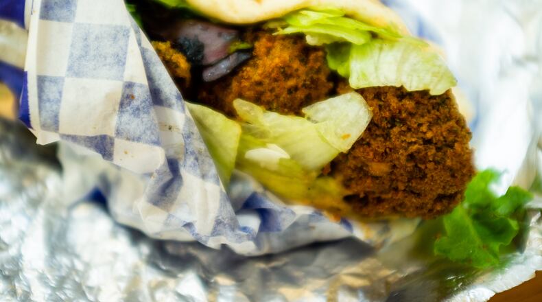 The densely-packed falafel wrap at Grecian Gyro will only cost you $6. CONTRIBUTED BY HENRI HOLLIS