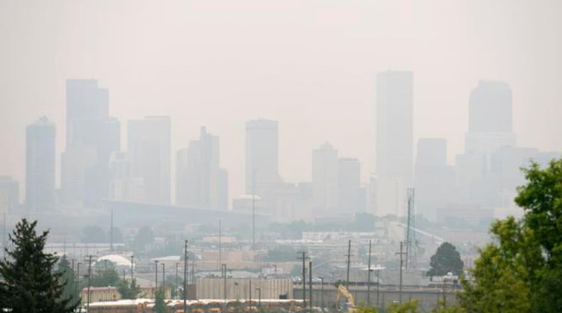 The Denver skyline, seen from Barnum Park, hides behind hazy skies Tuesday amid a smoke advisory for all of Colorado east of the Continental Divide because of wildfires in Canada. The haze led to flight delays at Denver International Airport on Tuesday morning, and the State Patrol warned motorists that the smoke could reduce visibility. The advisory was extended through Wednesday.<!--IPTC: DENVER, CO - JULY 7: A shot of downtown Denver from Barnum Park in Denver. (Photo by Kathryn Scott Osler/The Denver Post)-->