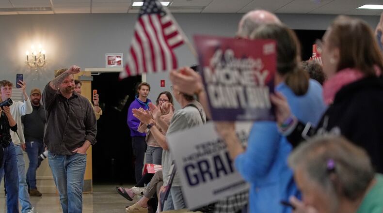 Graham Platner, Democratic candidate for U.S. Senate, acknowledges applause at a campaign event Sunday, June 7, 2026, in Portland, Maine. (AP Photo/Robert F. Bukaty)