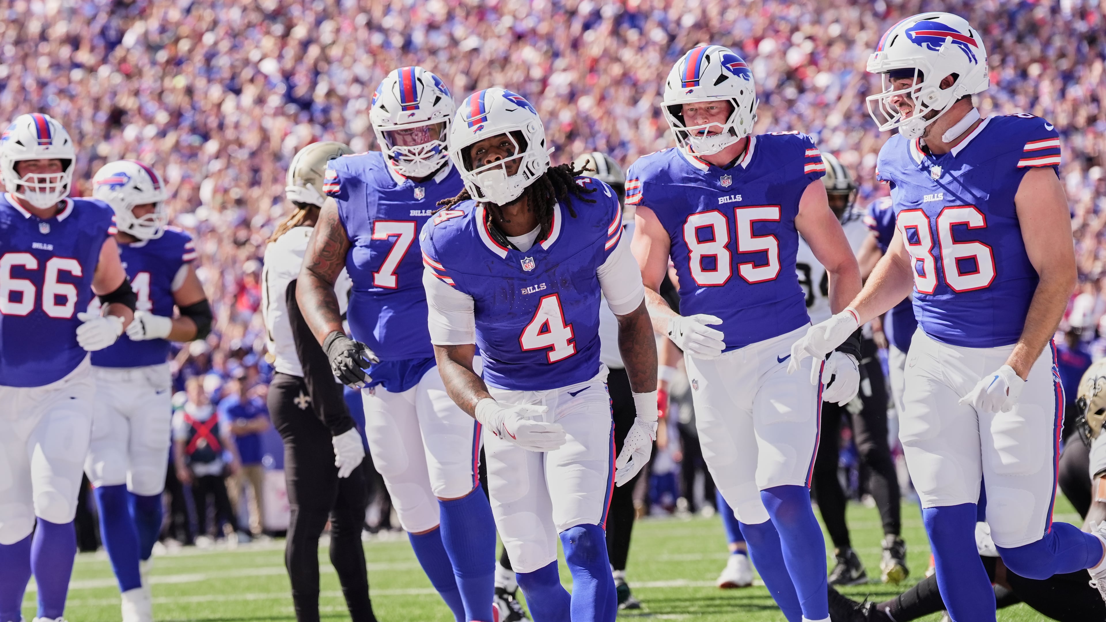 Buffalo Bills running back James Cook (4) celebrates his touchdown against the New Orleans Saints in the first half of an NFL football game, Sunday, Sept. 28, 2025, in Orchard Park, N.Y. (AP Photo/Sue Ogrocki)