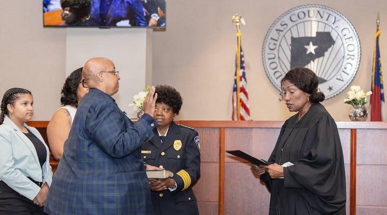 Attorney Valerie Vie is sworn in as Douglas County Probate Judge by Magistrate Judge Barbara Caldwell.