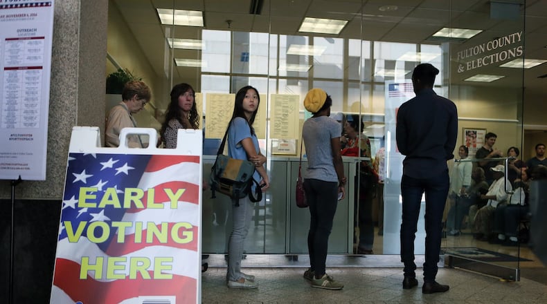 The line for voting extended out of the building at the Fulton County Government Center Oct. 17, the first day of early voting. BOB ANDRES /BANDRES@AJC.COM AJC File Photo