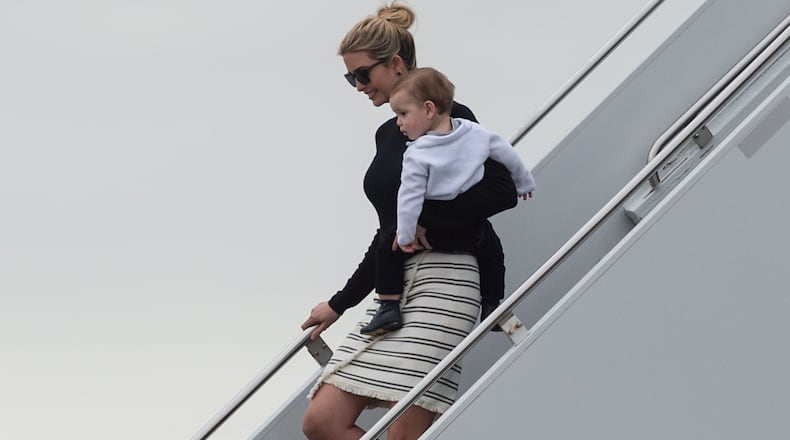 Ivanka Trump steps off Air Force One with her son Theodore upon arrival in West Palm Beach, Florida, on March 3, 2017. / AFP PHOTO / NICHOLAS KAMM