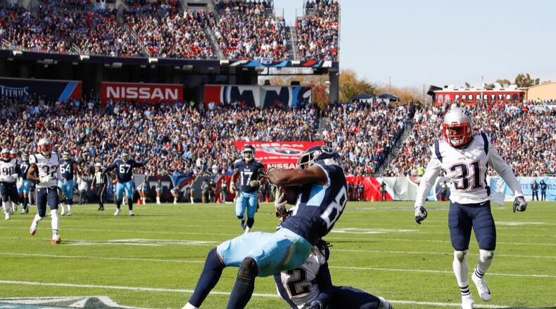 Jonnu Smith caught a touchdown pass for the Tennessee Titans on Sunday. A fan trying to catch a free T-shirt was critically injured when he fells from the stands.