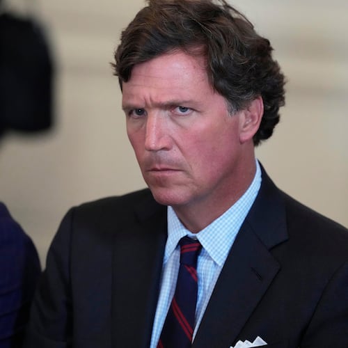 FILE - Tucker Carlson attends a meeting with President Donald Trump and oil executives in the East Room of the White House, Jan. 9, 2026, in Washington. (AP Photo/Alex Brandon, File)