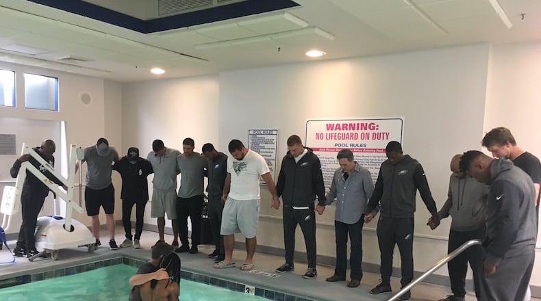 Philadelphia Eagles wide receiver Marcus Johnson was baptized in a pool before Thursday night's game against the Carolina Panthers.
