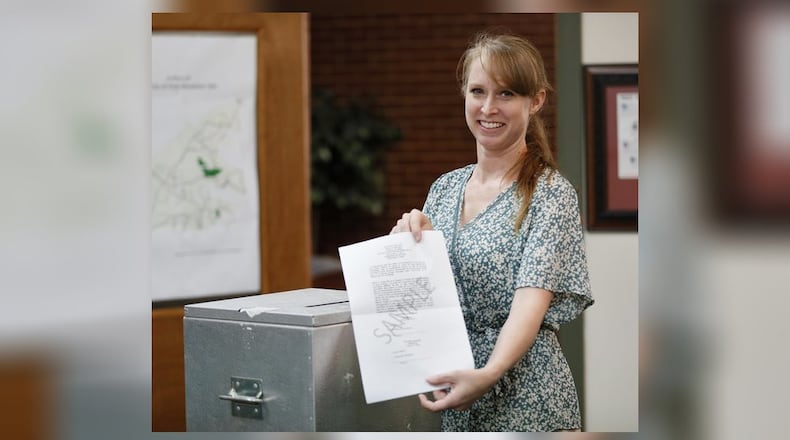 August 29, 2019, 2019 - Chattahoochee Hills - Dana Wicher with a sample ballot of the type used in their city elections, along with their ballot box. She is the city clerk and is in charge of elections in Chattahoochee Hills, a city that formed in 2007 and uses paper ballots as a cost-saving measure. Bob Andres / robert.andres@ajc.com