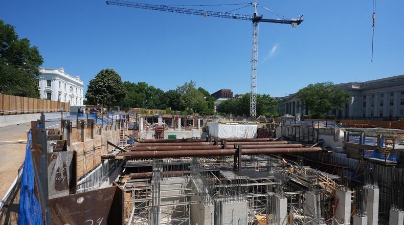 The Ballroom construction site can be seen as President Donald Trump tours the area at the White House, Tuesday, May 19, 2026, in Washington. (AP Photo/Jacquelyn Martin)