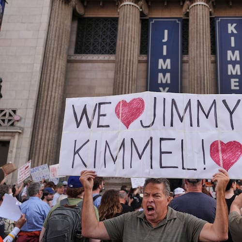 FILE - Oscar Villanueva holds a sign outside El Capitan Entertainment Centre, where the late-night show "Jimmy Kimmel Live!" is staged, Sept. 18, 2025, in Los Angeles. (AP Photo/Jae C. Hong, File)