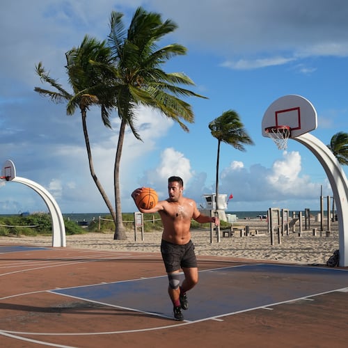 Gonzalo de Leon plays basketball at Fort Lauderdale Beach Park, the site of proposed pickleball courts as part of a new luxury development, Oct. 8, 2025, in Fort Lauderdale, Fla. (AP Photo/Lynne Sladky)