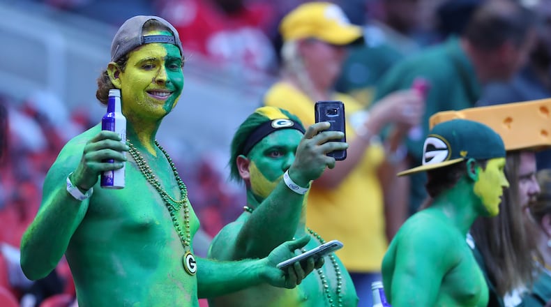 September 17, 2017 Atlanta: Packers fans Dallas Pennington (from left), Seth White, and Dillon Byrd sport green for their team as the Falcons prepare to play the Packers in a NFL football game on Sunday, September 17, 2017, in Atlanta.    Curtis Compton/ccompton@ajc.com