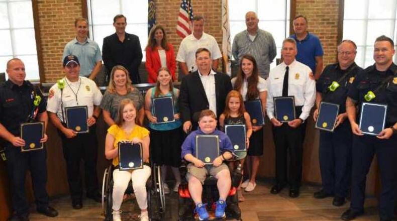 Milton City Council (top row) with members of the Milton Fire-Rescue Department, and MDA representatives and local MDA families.