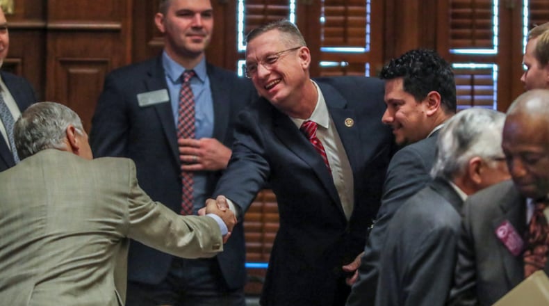 January 28, 2020 Atlanta: U.S. Rep. Doug Collins (center) shakes hands with members of the House before he addressed the Georgia House on Tuesday, Jan. 28, 2020 as its Chaplin of the day. This coming just hours after news broke that Collins is preparing to challenge U.S. Sen. Kelly Loeffler, and avoided any mention of seeking a higher office. In his sermon and closing prayer, Collins honored Rep. Jay Powell, the House Rules Committee chairman who died in November and who Collins described as a mentor. Speaker David Ralston signaled his support of the soon-to-be senate candidate, stopping short of an explicit endorsement. Collins and Ralston have a strong relationship dating back to their time as state house colleagues; Collins voted for Ralston’s speakership while deployed in Iraq. “He is my friend. He has stood by me when few would,†Ralston said.â€And I don’t forget things like that.†JOHN SPINK/JSPINK@AJC.COM