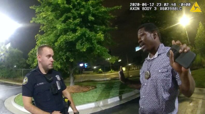 This screen grab taken from body camera video provided by the Atlanta Police Department on June 12, 2020, shows Rayshard Brooks, right, speaking with Officer Garrett Rolfe in the parking lot of a Wendy's restaurant, prior to being fatally shot by Rolfe. (Atlanta Police Department/Zuma Press/TNS)