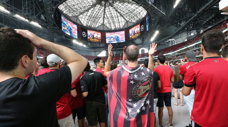 Atlanta United fans react after France scores a goal while watching the World Cup final on the halo board in Mercedes-Benz Stadium before their team takes on the Seattle Sounders in a MLS soccer game on Sunday, July 15, 2018, in Atlanta. Croatia, the crowd favorite, fell 4-2 to France. (Photo: Curtis Compton/ccompton@ajc.com)
